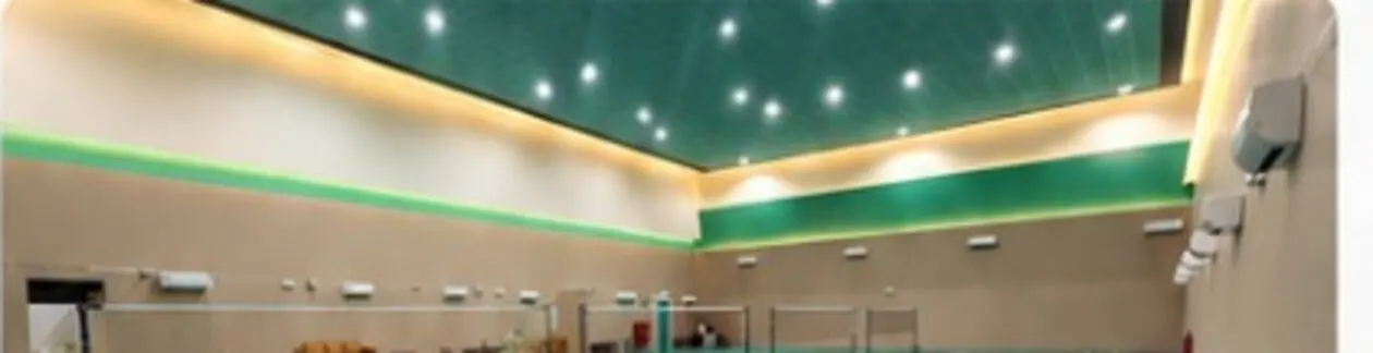 The green courts of SBH VIP Hall, lit and empty before the tournament
